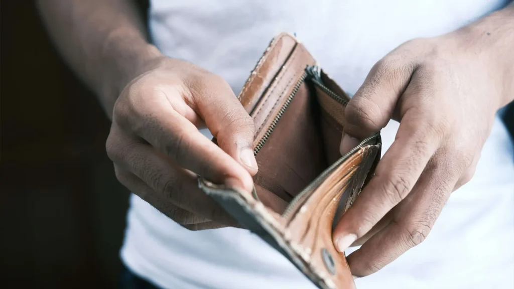 Hands opening an empty wallet